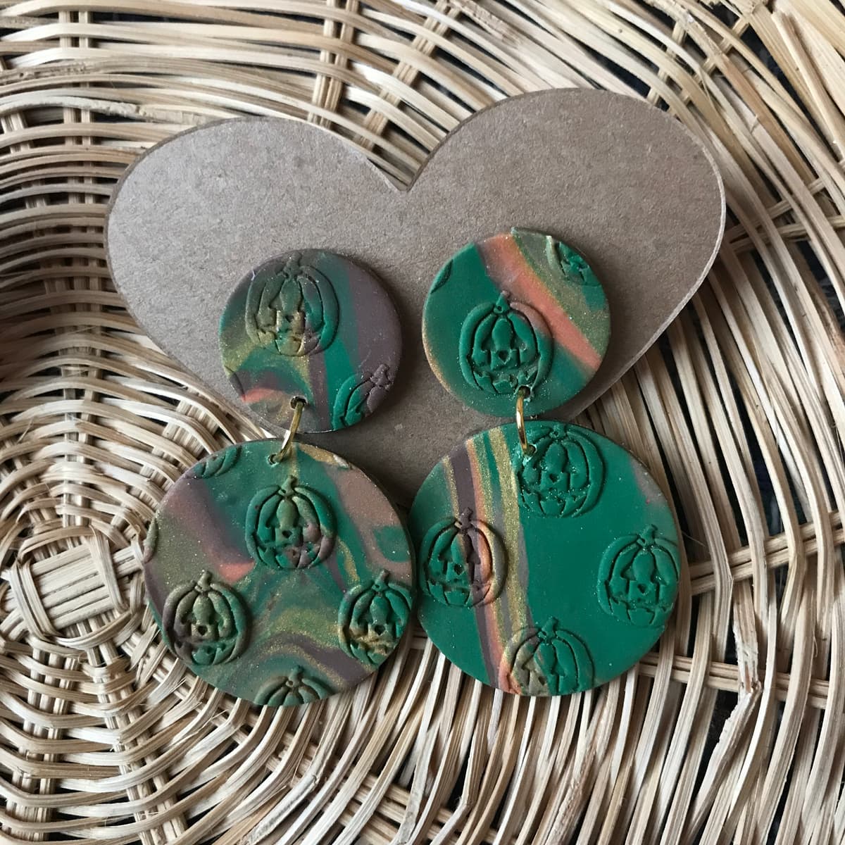 The selected image of Green Marbled Jack-o-Lantern Embossed Polymer Clay Dangle Earrings