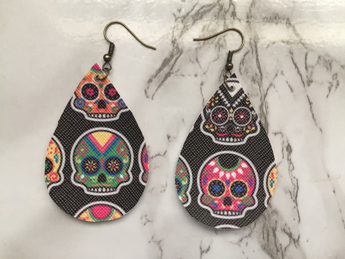 The selected image of Dia de Los Muertos Candy Skull Faux Leather Halloween Earrings