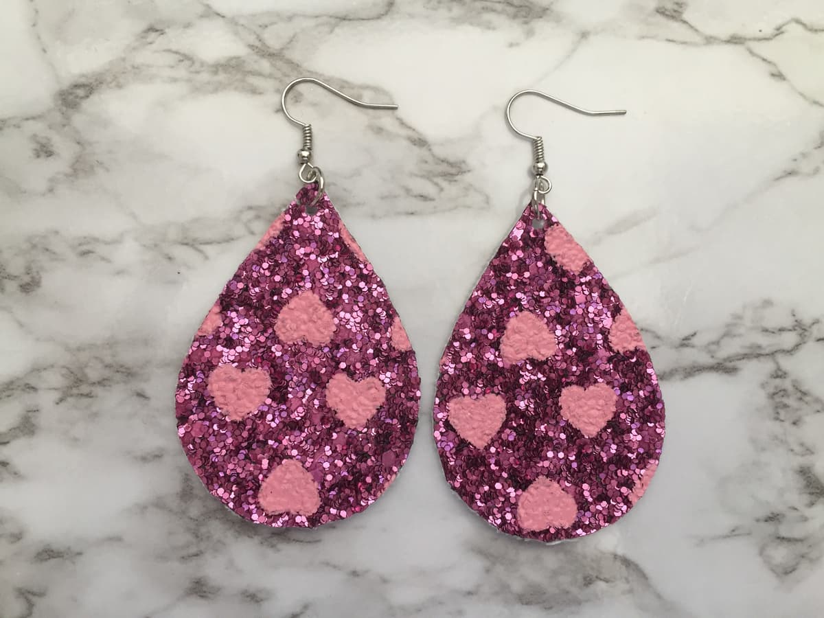 The selected image of Pink Sparkly Hearts Dangle Earrings