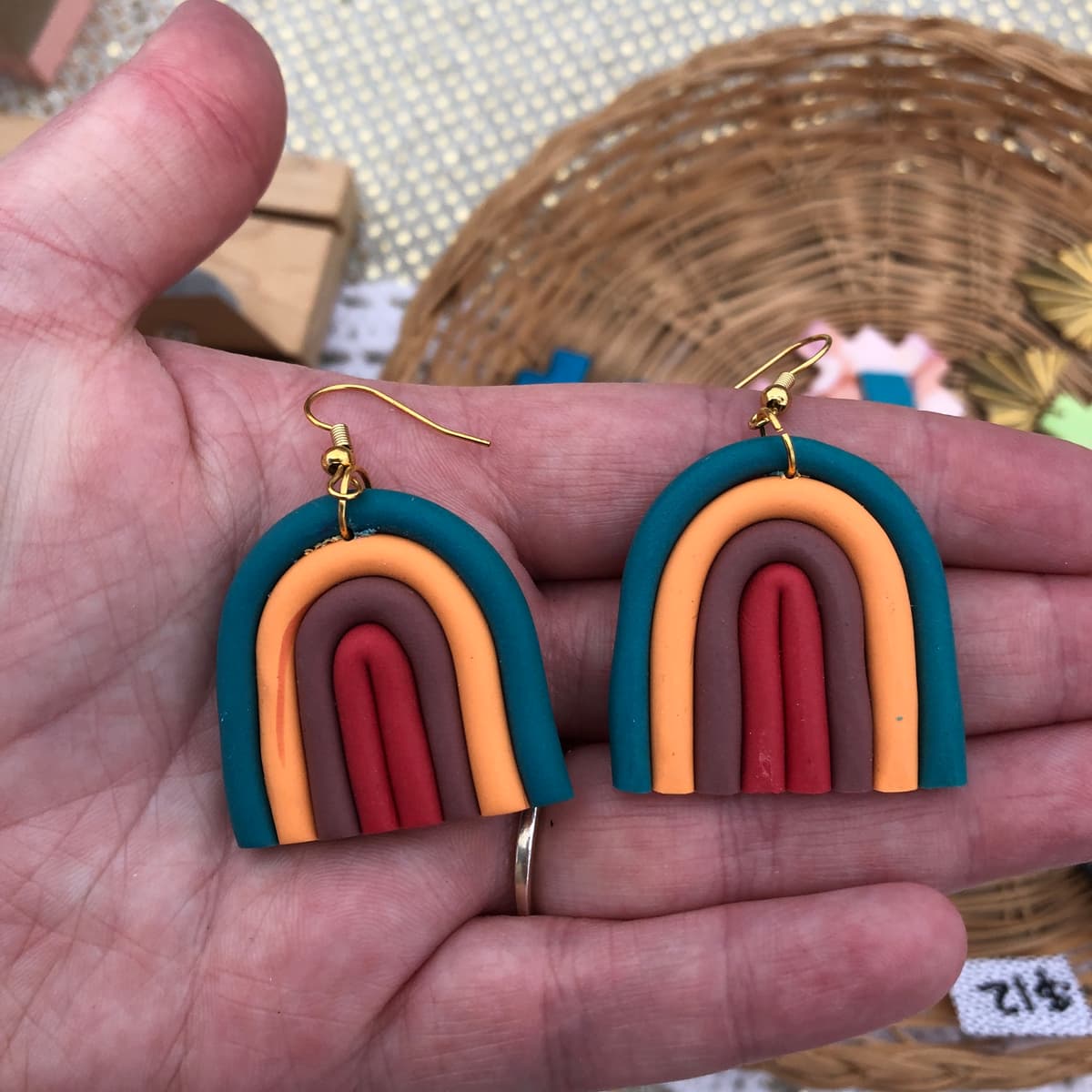 The selected image of Orange, Blue, and Brown Rainbow Arch Polymer Clay Dangle Earrings