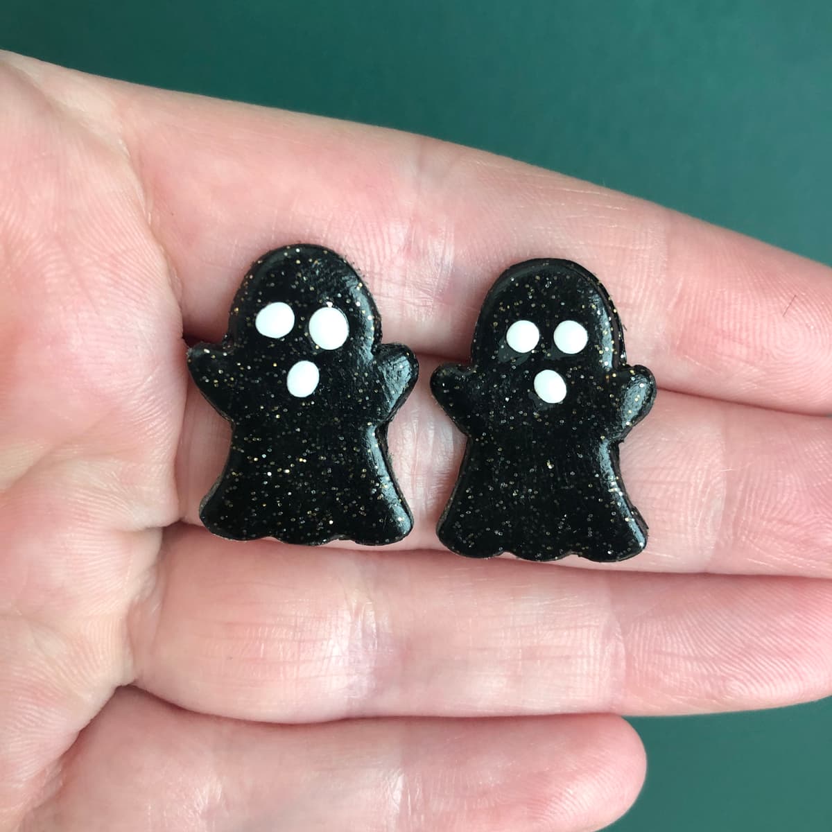 The selected image of Black and White Sparkly Ghost Polymer Clay Halloween Stud Earrings